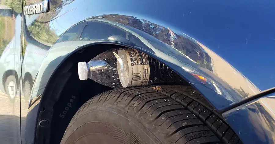 Plastic Bottle On Car Tire